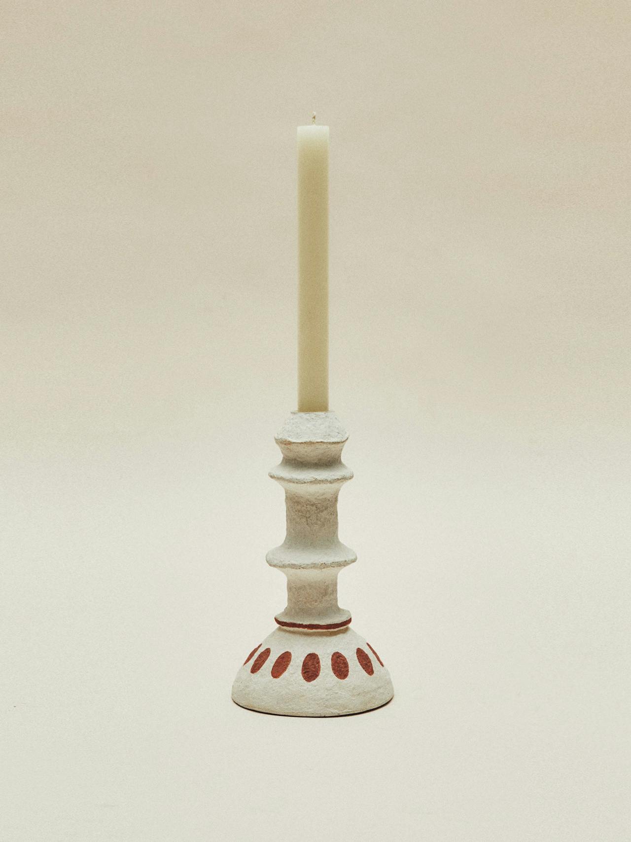 Curvy papier-mâché candlestick