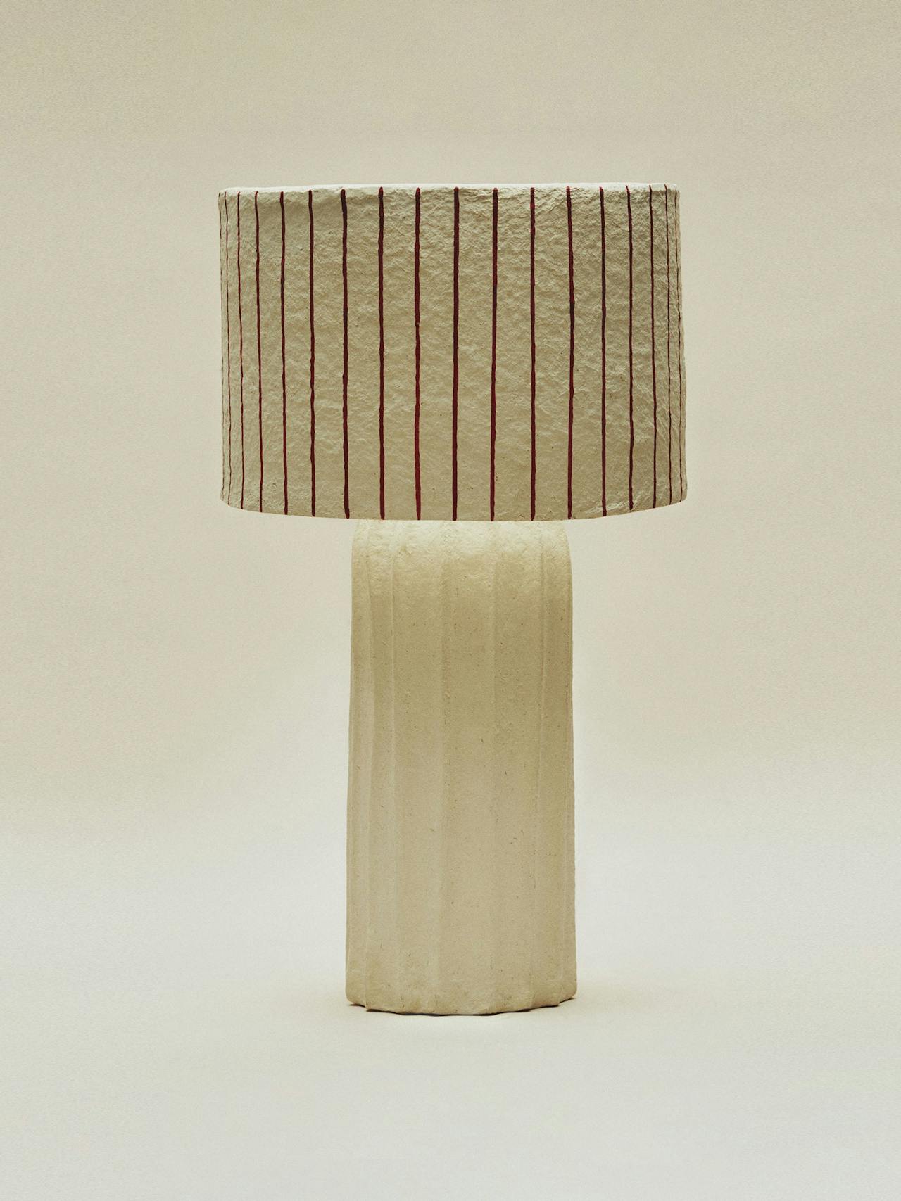 Papier-mâché table lamp with striped shade