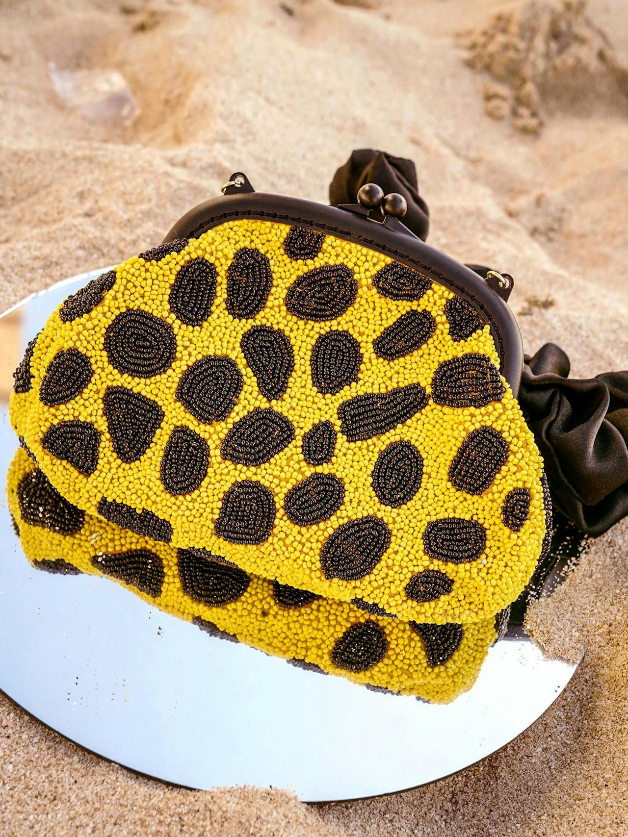 Arnoldi venom hand-beaded clutch bag in black and yellow Handbags BrunnaCo    - Collagerie