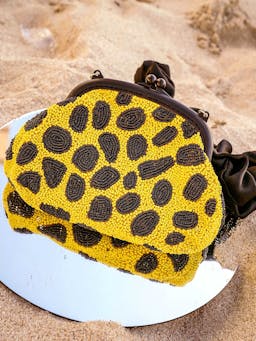 Arnoldi venom hand-beaded clutch bag in black and yellow Handbags BrunnaCo    - Collagerie