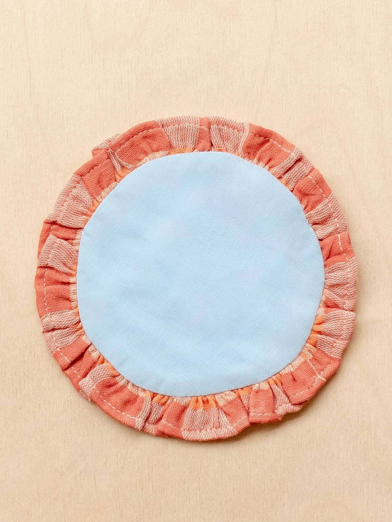 Cotton coasters in blue and apricot, set of 2
