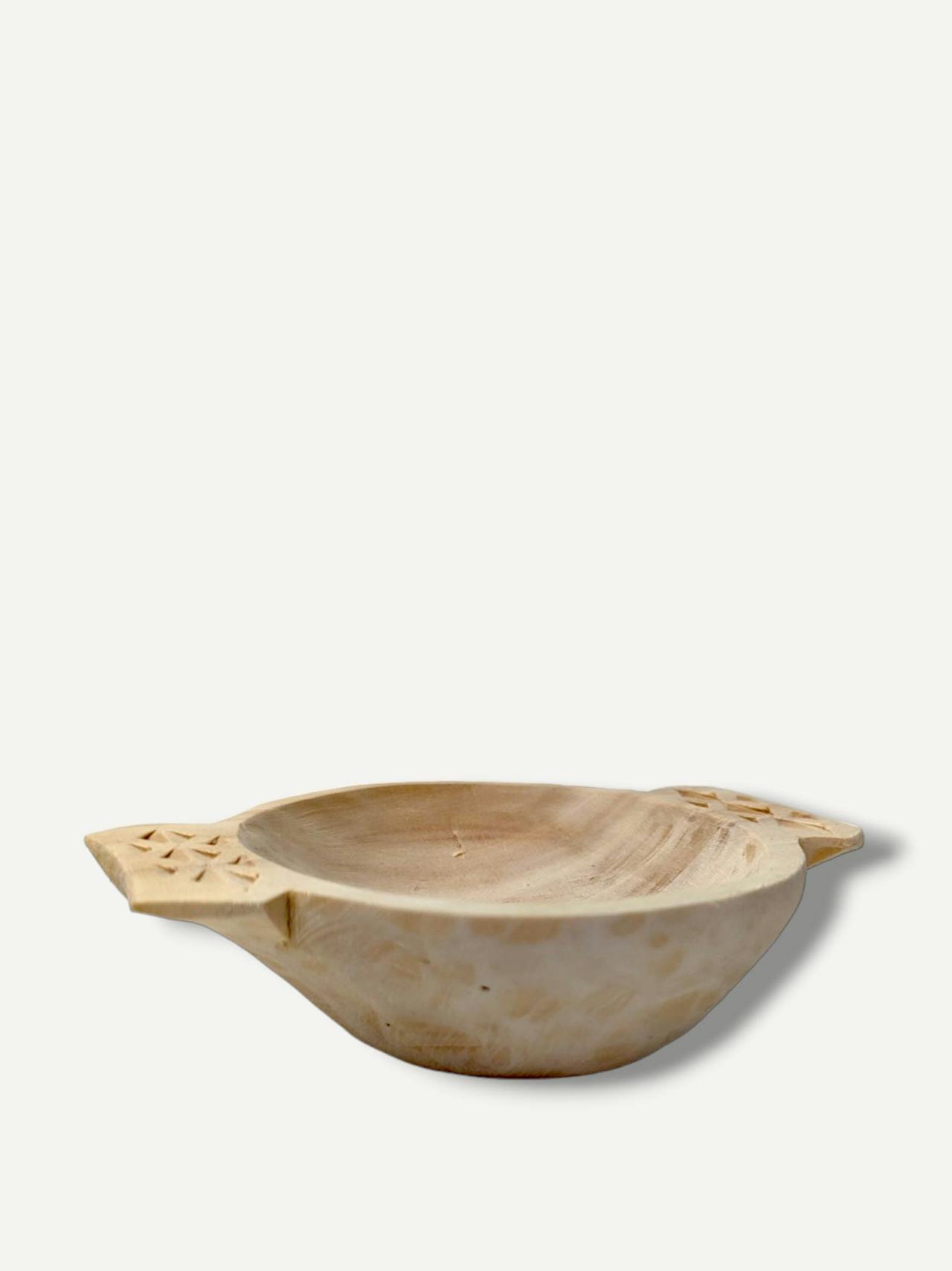 Wooden bowl with carved handles