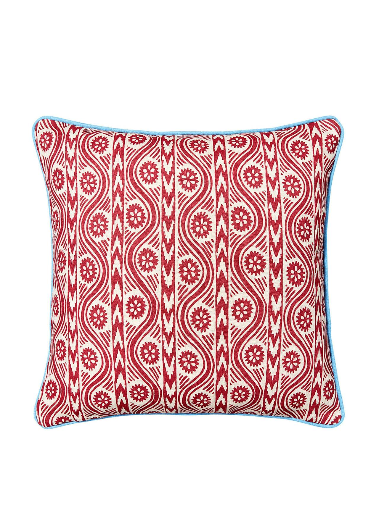 Red Ruslan print cushion with cornflower blue trim