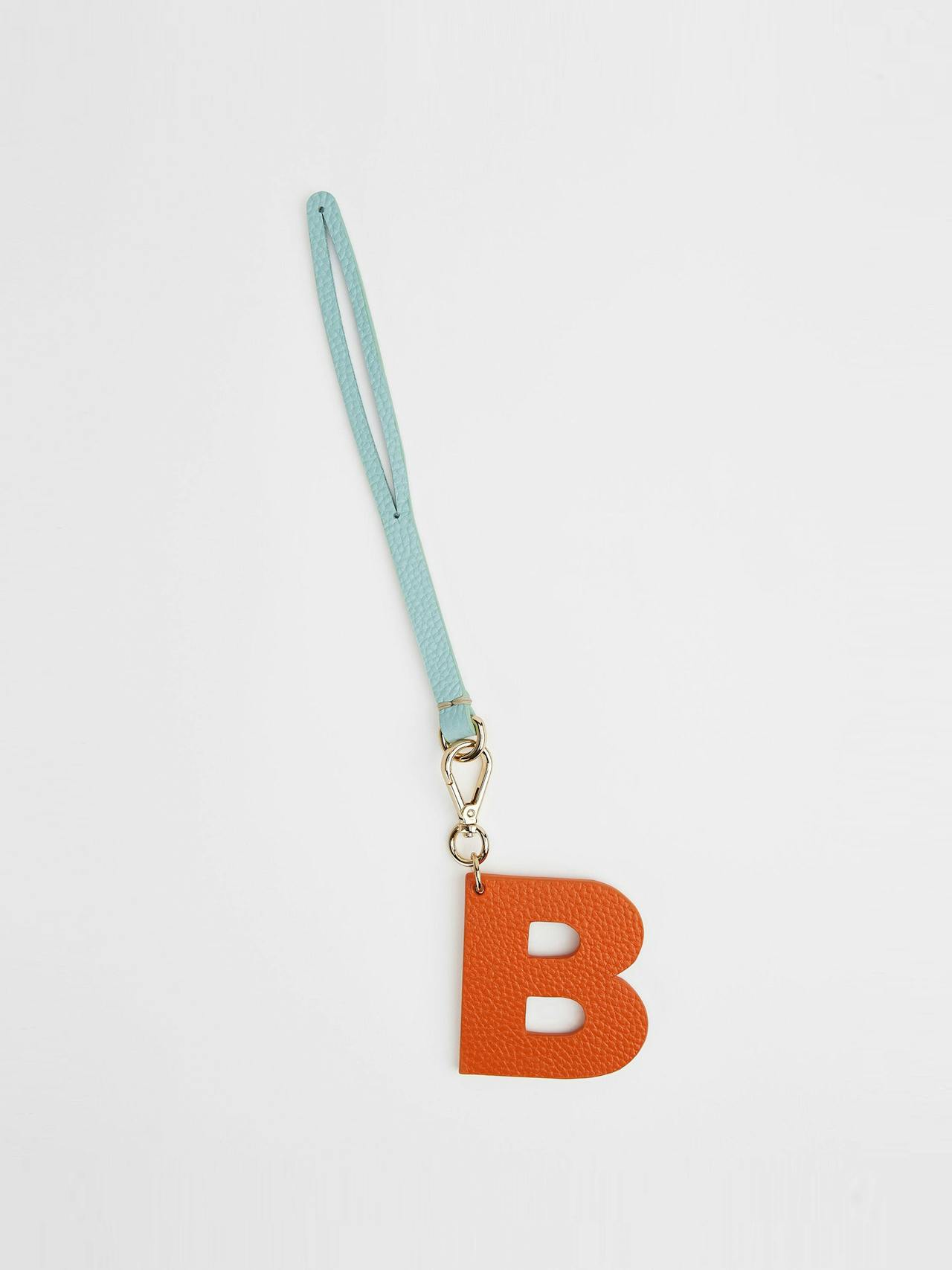 The orange and baby blue letter charm