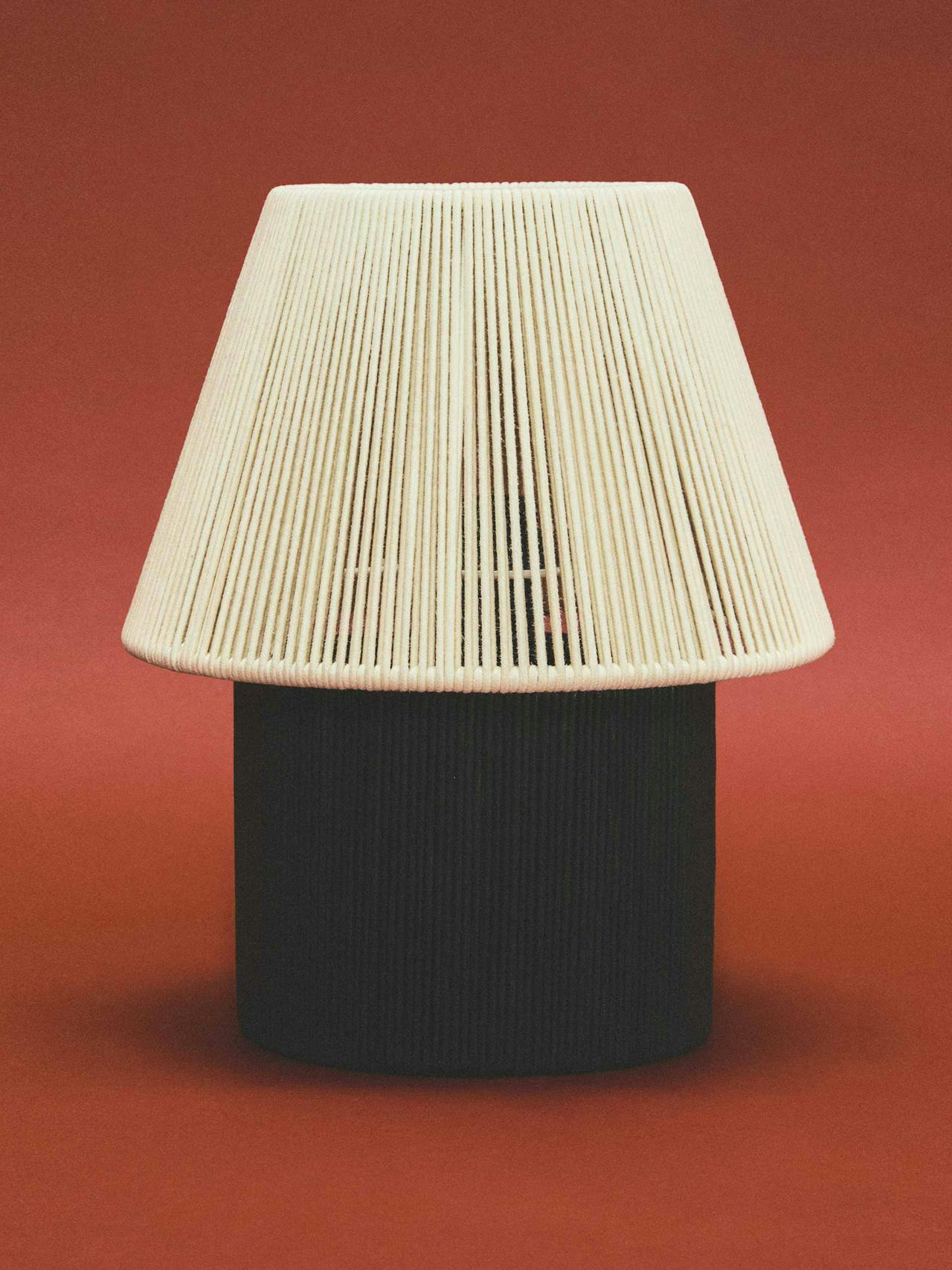 Table lamp with cord shade