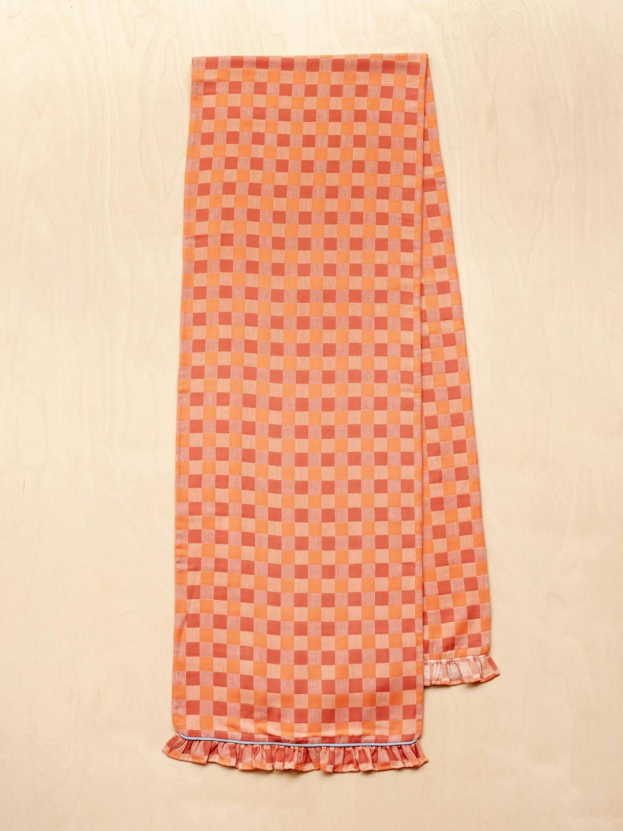 Cotton table runner in apricot checkerboard
