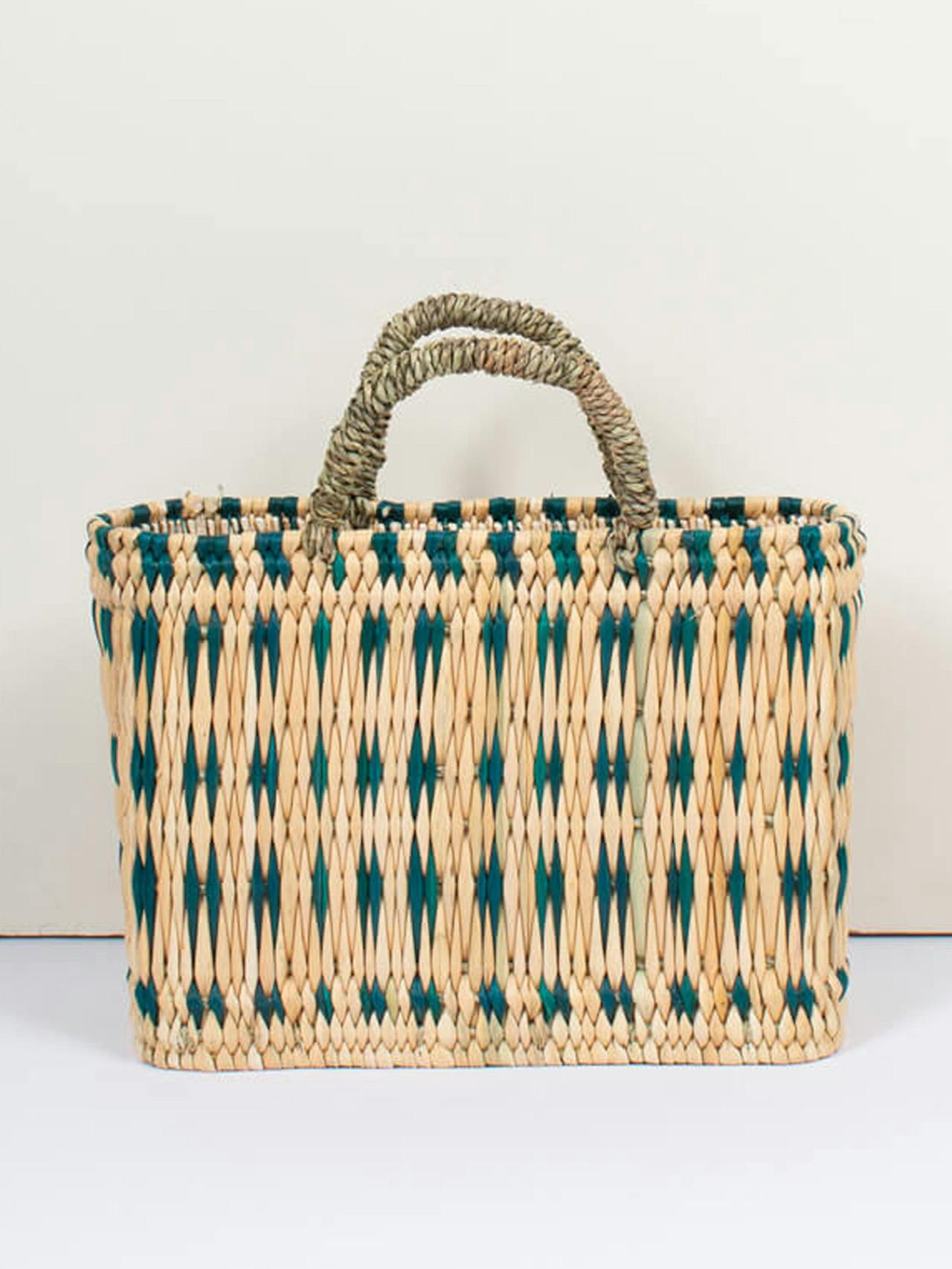 Woven reed basket in green