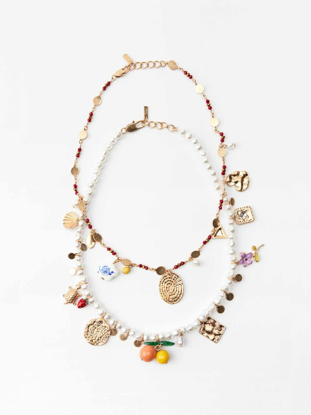 Pack of faux pearl and beaded necklaces with charms