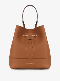 Wearable as a crossbody or carried in the hand, this leather Strathberry drawstring bucket bag is sized to fit all your everyday needs. Collagerie.com