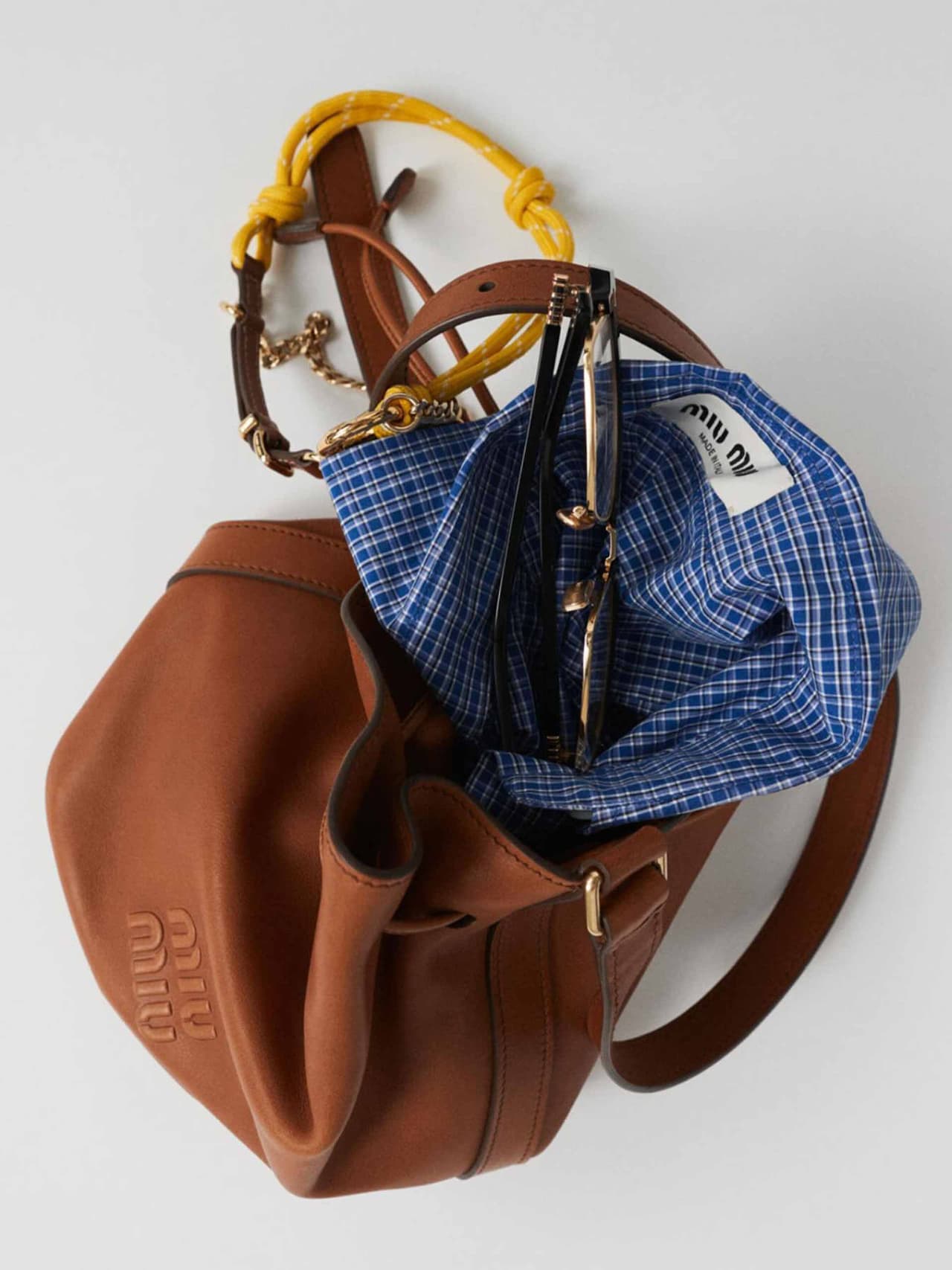 travel-holding-miu-miu